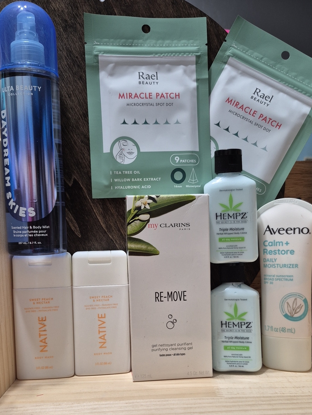 Rare Beauty skin care set with green, white, blue accents
